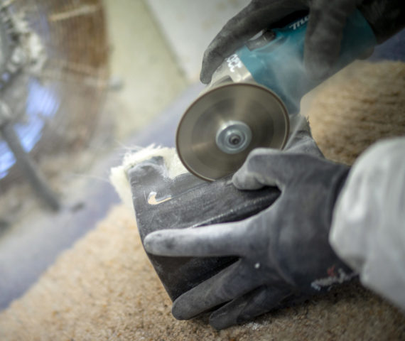 Image of worker trimming a fibre composite component