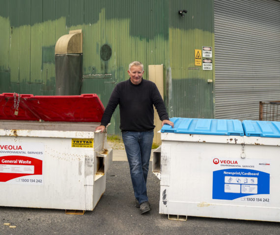 IMage of person with recycling bins