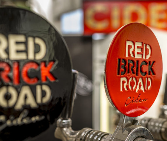 Image of bar taps at Red Brick Road Ciderworks